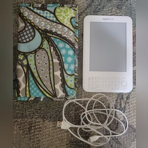 Amazon Kindle with charging cord and Thirty-one carrying case
